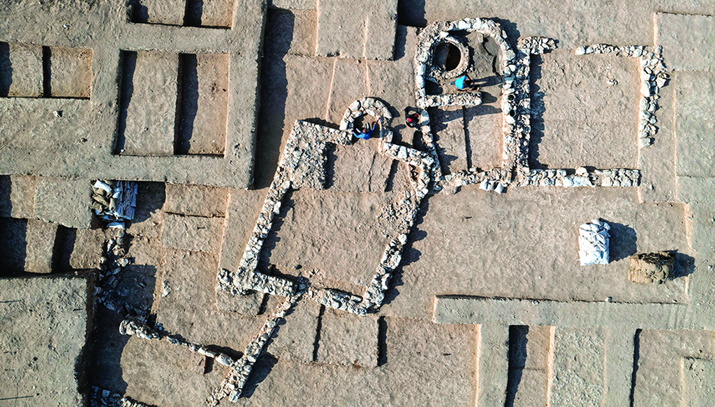 An aerial view shows Palestinian workers of Zionist's Antiquities Authority during work at a recently discovered ancient mosque, which dates back to the early Islamic period, in the Bedouin town of Rahat in Israel's southern Negev desert. — AFP  