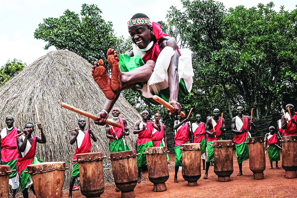 Elite drummers performer perform in front of a re-constructed house of the king’s village at Gishora Drum Sanctuary in Gishora, Burund. — AFP photos