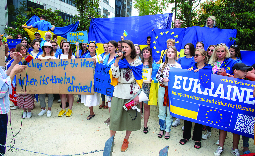 BRUSSELS: Demonstrators gather outside the European Headquarters part as they protest in support of Ukraine's application for EU candidacy status during an EU-Western Balkans leaders' meeting in Brussels on June 23, 2022. - AFP