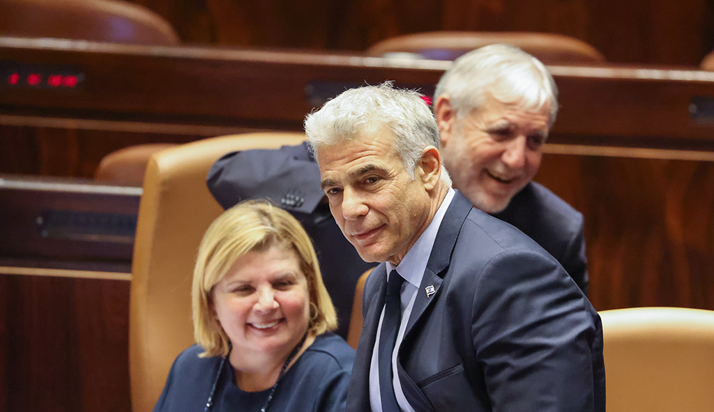 JERUSALEM: Zionist entity's Minister of Foreign Affairs Yair Lapid (C) takes part in a Knesset (parliament) session in Jerusalem. - AFP
