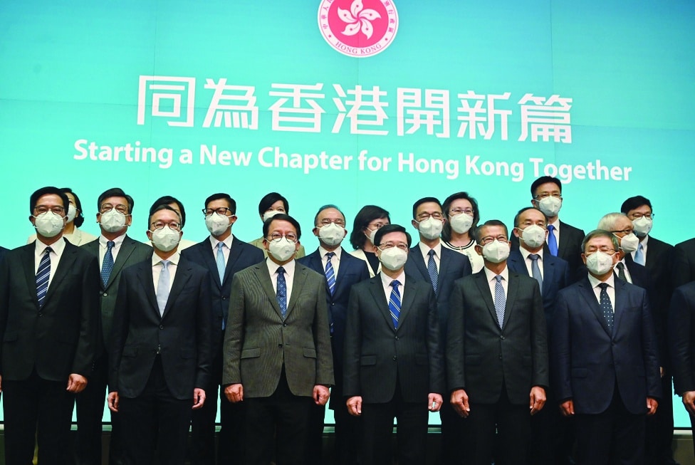 HONG KONG: Hong Kong's Chief Executive-elect John Lee (front 3rd R) poses for a photo with his newly-appointed cabinet at the central government headquarters in Hong Kong on June 19, 2022. - AFP