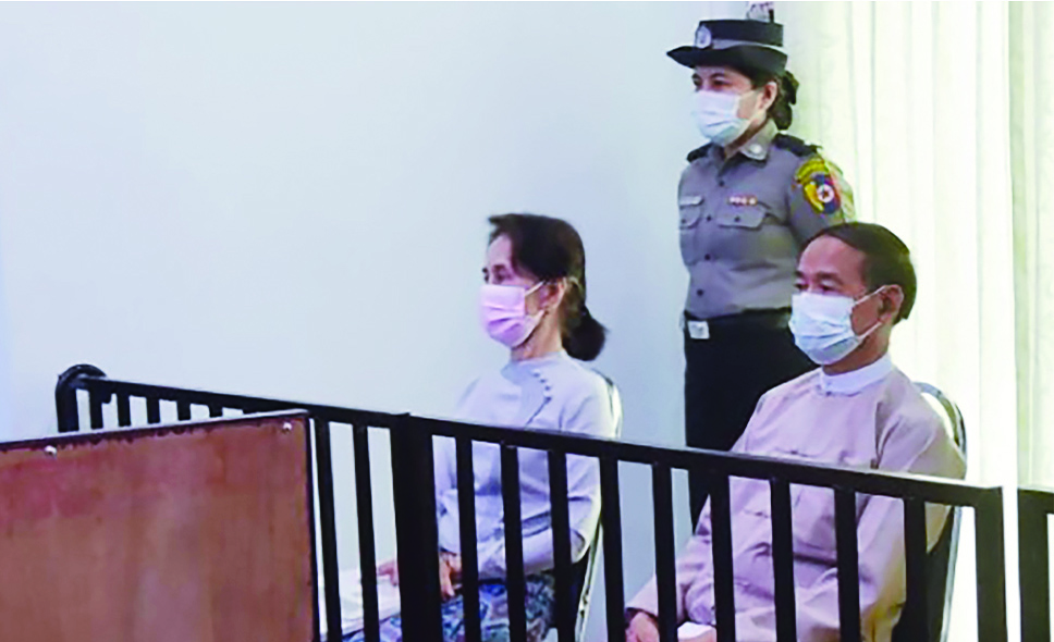 NAYPYIDAW, Myanmar: File photo shows detained civilian leader Aung San Suu Kyi (L) and detained president Win Myint are seen during their first court appearance in Naypyidaw, since the military detained them in a coup on February 1. - AFP