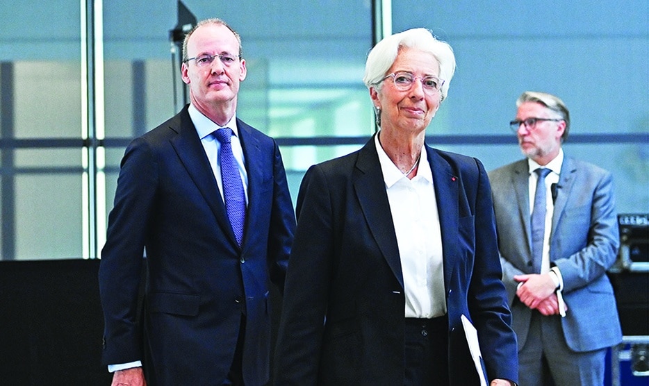 AMSTERDAM: Christine Lagarde (center), President of the European Central Bank (ECB) and President of The Netherlands Bank (DNB) Klaas Knot (left) arrive for a press conference on Governing Council meeting focused on monetary policy in the euro zone in Amsterdam on June 09, 2022. – AFP