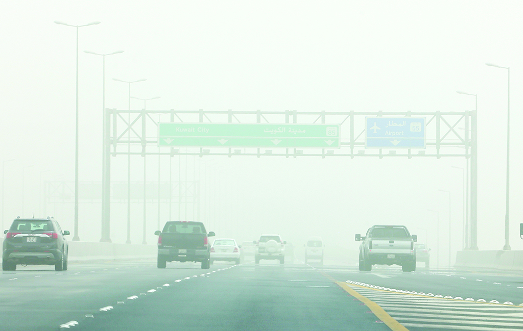 KUWAIT: Vehicles drive on a main highway in Kuwait during a sandstorm on June 26, 2022. - Photo by Yasser Al-Zayyat
