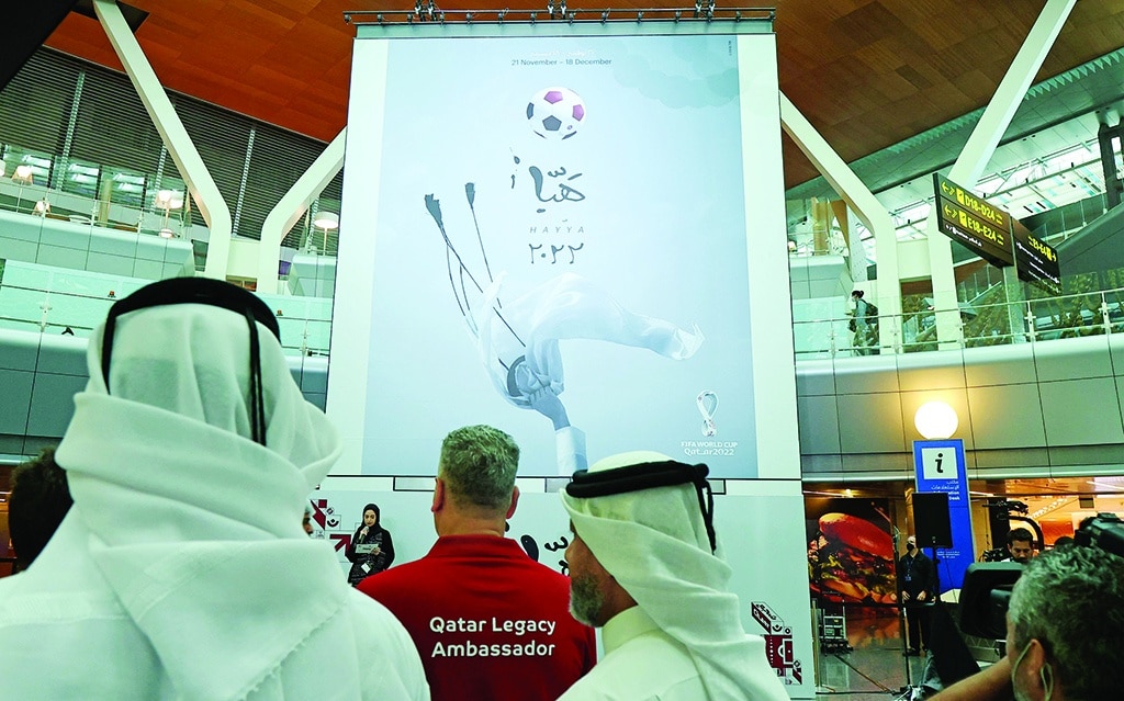 DOHA: The official poster of Qatar¡¯s FIFA World Cup is unveiled at Hamad International Airport in Doha on June 15, 2022. - AFP