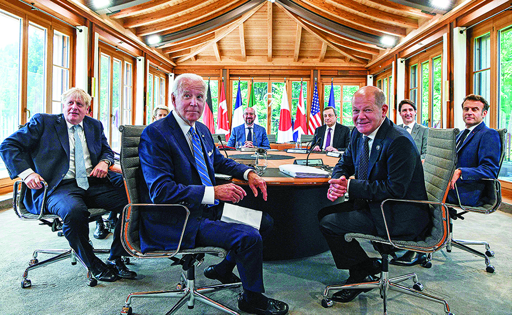 ELMAU CASTLE: (Left to right) Britain's Prime Minister Boris Johnson, European Commission President Ursula von der Leyen, US President Joe Biden, European Council President Charles Michel, Italy's Prime Minister Mario Draghi, Germany's Chancellor Olaf Scholz, Canada's Prime Minister Justin Trudeau and France's President Emmanuel Macron attend a working lunch to discuss shaping the global economy on June 26, 2022. - AFP