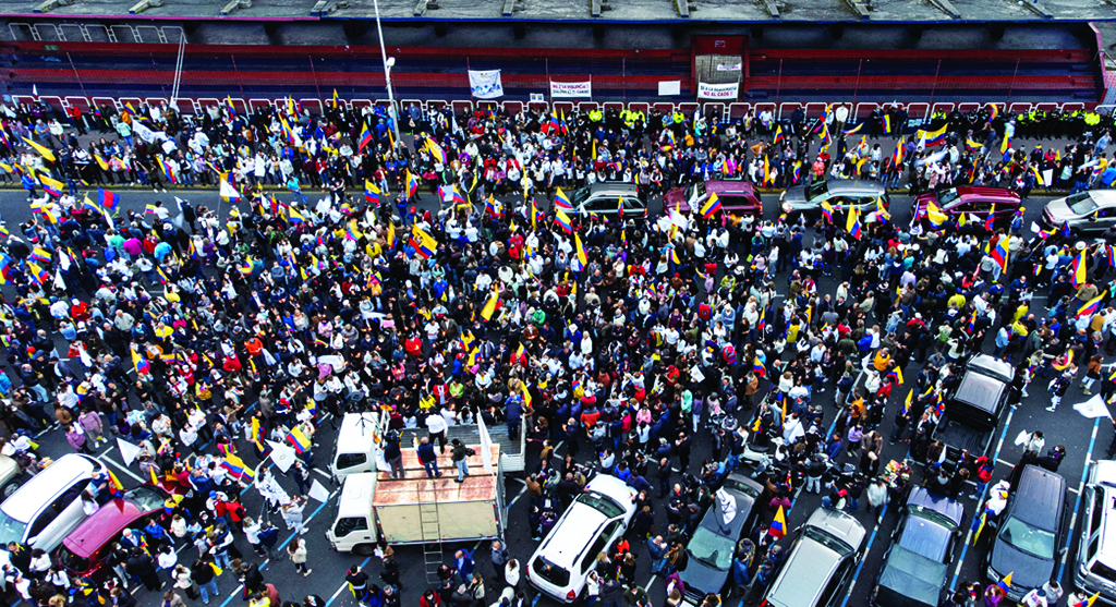 QUITO: Aerial view of Ecuadorean government supporters holding a demonstration demanding for peace in northern Quito. - AFP