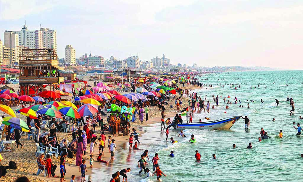 People gather at the beach, along the shore of Gaza City, on June 13, 2022. - AFP photos