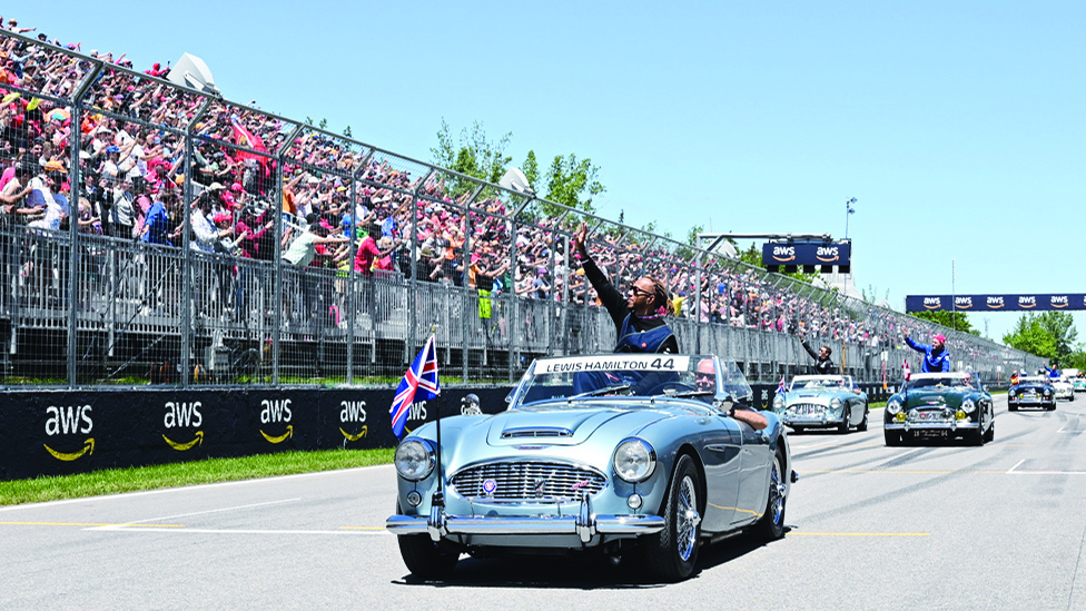 MONTREAL: Mercedes' British driver Lewis Hamilton waves to the crowd during the parade of drivers, ahead of the Canada Formula 1 Grand Prix at Circuit Gilles-Villeneuve in Montreal. - AFP
