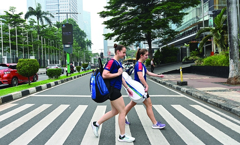 JAKARTA: Ukraine's women's doubles badminton players Yelyzaveta Zharka (right) and Mariia Stoliarenko walk back to their hotel after competing in the Indonesia Open badminton tournament in Jakarta. - AFP