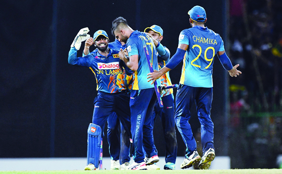 COLOMBO: Sri Lanka's Captain Dasun Shanaka (centre) and team mates celebrate after Sri Lanka won by 4 runs during the fourth one-day international (ODI) cricket match between Sri Lanka and Australia in Colombo.- AFP