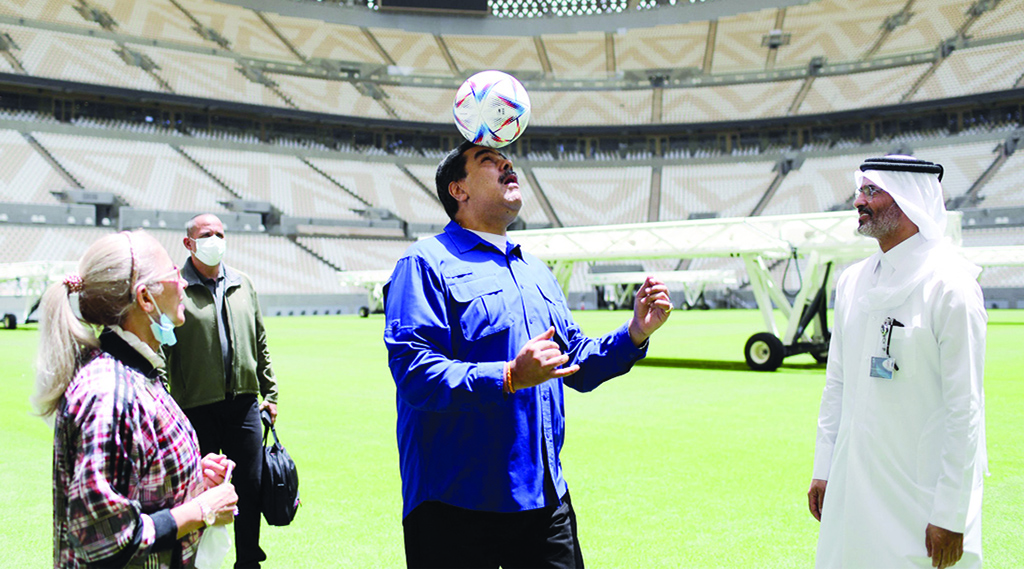 DOHA:  Venezuela´s President Nicolas Maduro heads a ball during his visit to the Lusail stadium, where the closing ceremony of the FIFA World Cup Qatar 2022 will take place, in Doha. - AFP