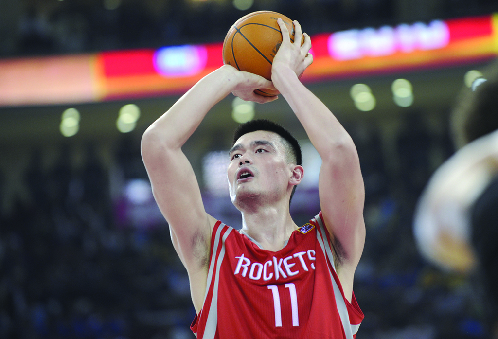 BEIJING: In this file photo, Houston Rockets All-Star Yao Ming takes a penalty shot during their match against the New Jersey Nets in the NBA China Games 2010 basketball match at the Wukesong Arena.- AFP