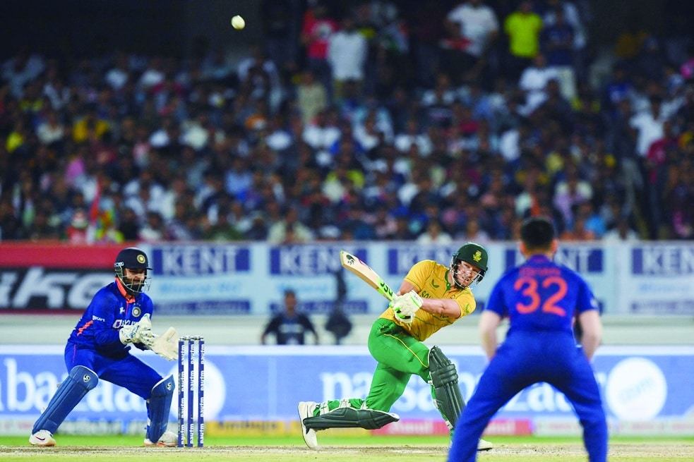 RAJKOT: South Africa's David Miller (center) plays a shot during the fourth Twenty20 international cricket match between India and South Africa at the Saurashtra Cricket Association Stadium in Rajkot on June 17, 2022. - AFP