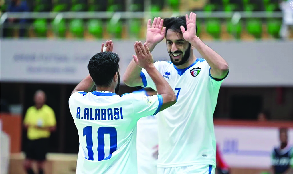 DAMMAM: Kuwait National Futsal team players celebrate after beating Mauritania 7-2 on Tuesday in the Arab Cup in Dammam, Saudi Arabia.