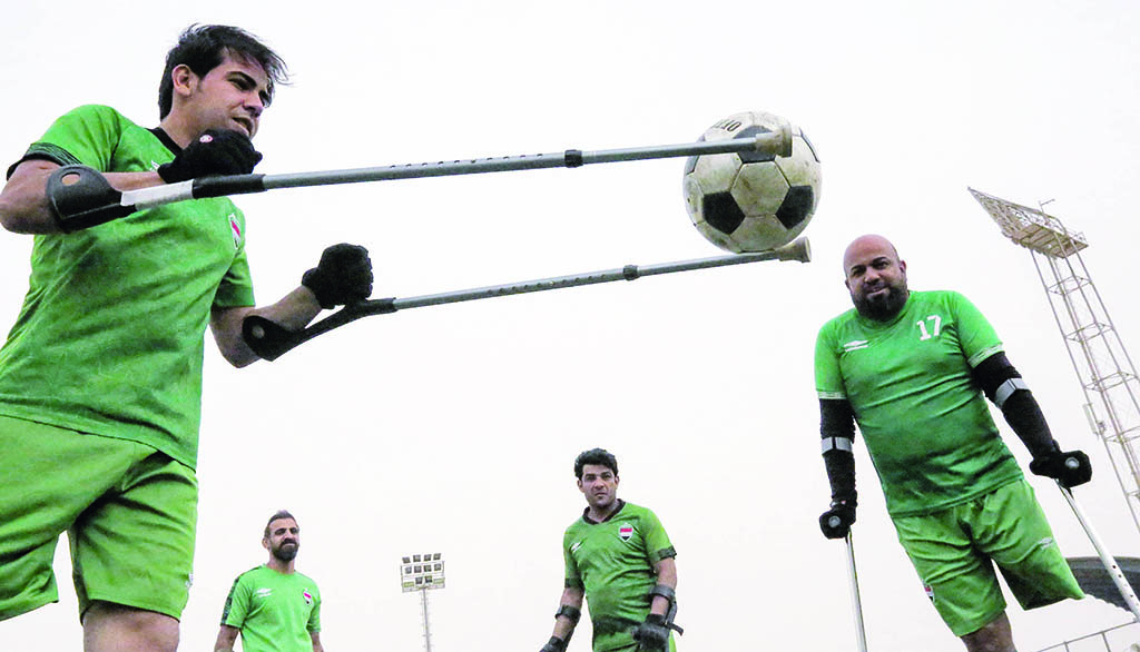 BAGHDAD: Members of the Iraqi national football team for amputees take part in a training session at Al-Shaab stadium of the 'National Centre for Nurturing Sports Talent' in Iraq's capital Baghdad. - AFP
