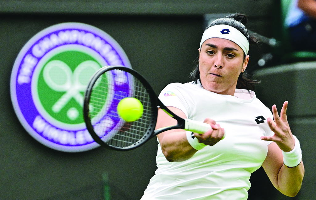 WIMBLEDON: Tunisia's Ons Jabeur returns the ball to Sweden's Mirjam Bjorklund during their women's singles tennis match on the first day of the 2022 Wimbledon Championships at The All England Tennis Club in Wimbledon, southwest London, on June 27, 2022. - AFP