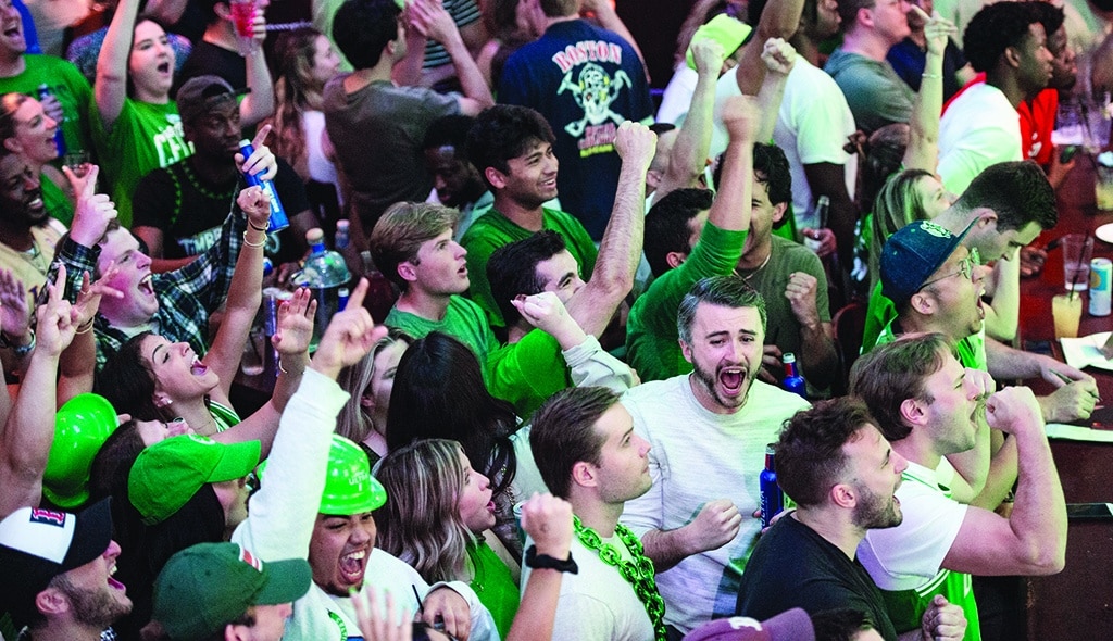 BOSTON: Fans at The Greatest Bar celebrate the Celtics scoring points and leading in the game during the first quarter of the game during game three of the NBA playoffs with the Boston Celtics taking on the Golden State Warriors on June 8, 2022. - AFP