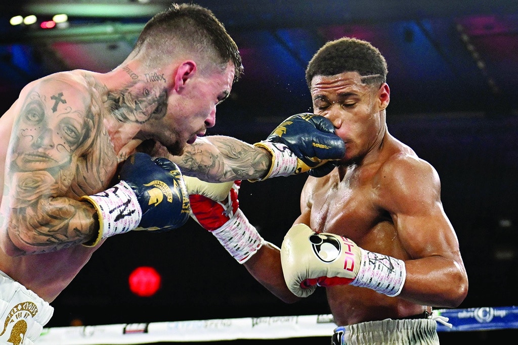 MELBOURNE: Devin Haney of the US (right) fights with Australia's George Kambosos during their lightweight title boxing match in Melbourne on June 5, 2022.- AFP