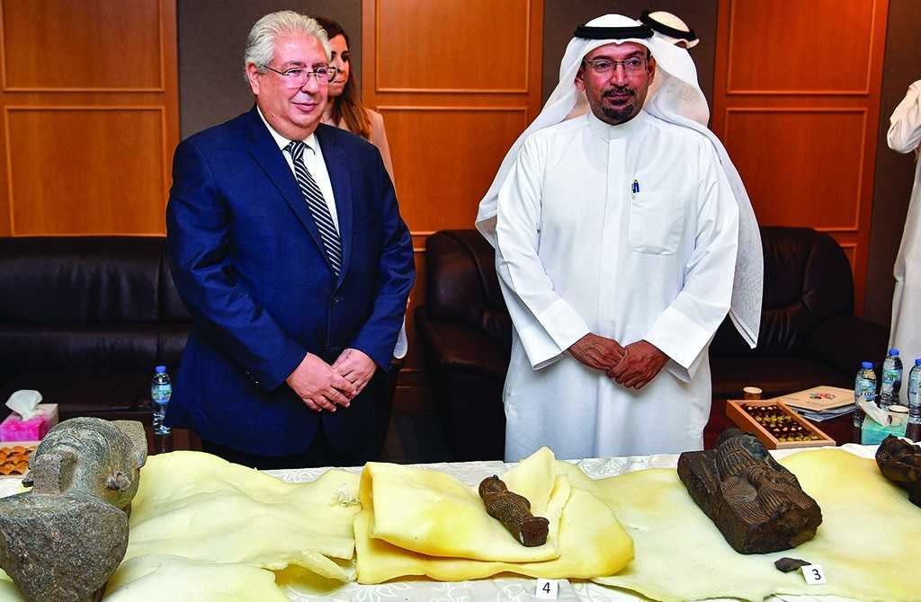 KUWAIT: Director of Artifacts and Museums at NCCAL Sultan Al-Duwaish stands with Egyptian Ambassador Osama Shaltout during the handover of five smuggled artifacts on June 16, 2022. - Photo by Yasser Al-Zayyat