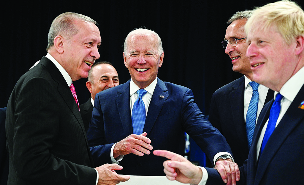 MADRID: (From left) Turkey's President Recep Tayyip Erdogan, US President Joe Biden, NATO Secretary General Jens Stoltenberg and Britain's Prime Minister Boris Johnson speak at the start of the NATO summit on June 29, 2022. - AFP