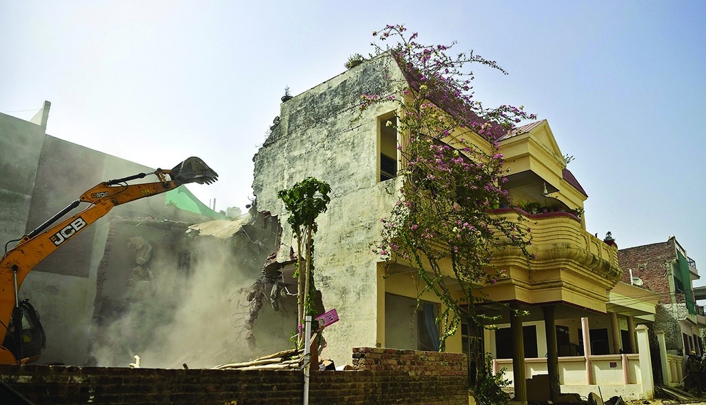 ALLAHABAD: A bulldozer demolishes the residence of Javed Ahmed, a local leader who was allegedly involved in the protests against former BJP spokeswoman Nupur Sharma's incendiary remarks about Prophet Muhammad (PBUH), on June 12, 2022. - AFP