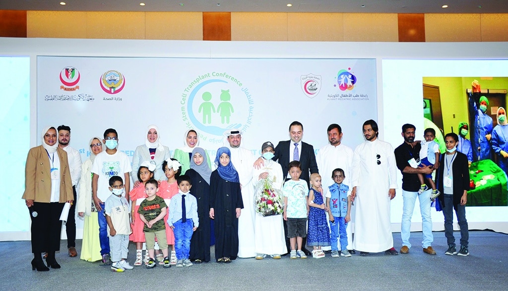 KUWAIT: Health ministry officials pose for a group picture with children who have had stem cell transplant procedures, and their families. – KUNA photos