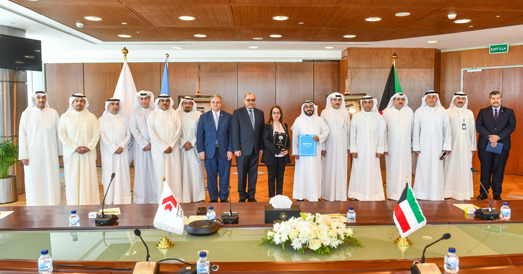 KUWAIT: Officials pose for a group picture after signing the agreement. - KUNA