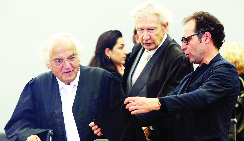 BRANDENBURG AN DER HAVEL, Germany: (L to R) Plaintiff lawyer Thomas Walther, and co-plaintiff lawyers Hans-Jurgen Foerster and Pascal Luongo arrive for the sentencing hearing of the trial of former Nazi concentration camp guard Josef Schuetz. - AFP
