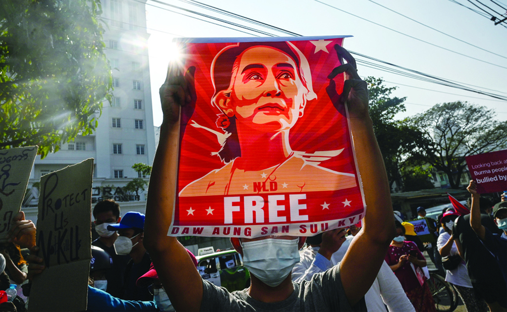 YANGON, Myanmar: File photo shows, a protester holds up a poster featuring Aung San Suu Kyi during a demonstration against the military coup in front of the Central Bank of Myanmar in Yangon. - AFP