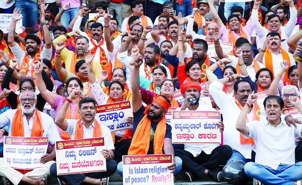 BANGALORE, India: Activists of the right wing Hindu Janajagruti Samithi organisation shout slogans during a protest against the recent killing of Hindu tailor Kanhaiya Lal in Udaipur allegedly by two Muslim men for supporting a former spokeswoman of the ruling Bharatiya Janata Party (BJP) party. - AFP