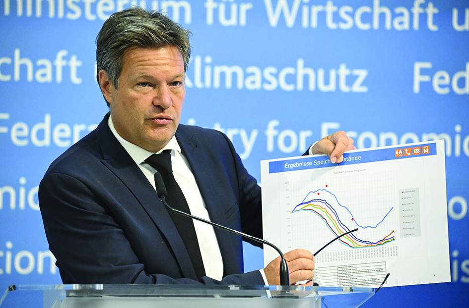 BERLIN, Germany: German Minister of Economics and Climate Protection Robert Habeck shows a graph featuring forecasts of gas storage levels as he gives a press conference on energy supply security, on June 23, 2022 at his Ministry in Berlin. - AFP