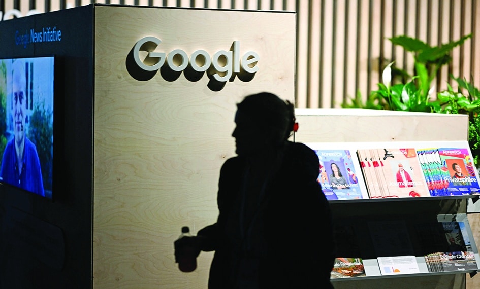 BERLIN: A woman passes by a booth of Google at the re:publica 2022 digital media convention in Berlin. - AFP