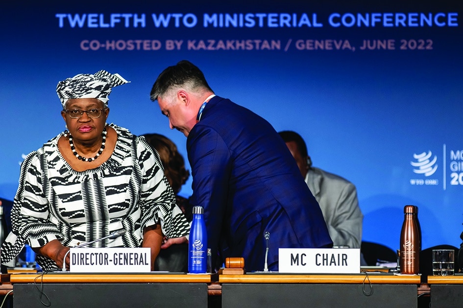 GENEVA: Nigerian Director General of the World Trade Organisation (WTO), Ngozi Okonjo-Iweala, (left), and MC12 Chair, Timur Suleimenov, stand at the opening ceremony of the 12th Ministerial Conference (MC12) at the headquarters of the World Trade Organization (WTO) on June 12, 2022. - AFP