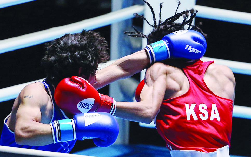 KUWAIT : Iraq's Muntadher Naser Ali (left) and KSA's Abdulaziz Al-Atbi compete during the third day of the Kuwait International Boxing Championship at the Kuwait Boxing Hall in the Sabah Al-Salem district on the outskirts of Kuwait city on July 23, 2022. - Photos by Yasser Al-Zayyat