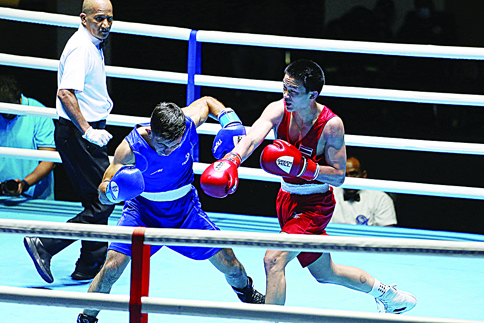 KUWAIT: Thailand's Sarawut Suthet (right) and Iran's Sajid Mohammad compete during the Kuwait International Boxing Championship at the Boxing Hall on July 24, 2022. - Photos by Yasser Al-Zayyat