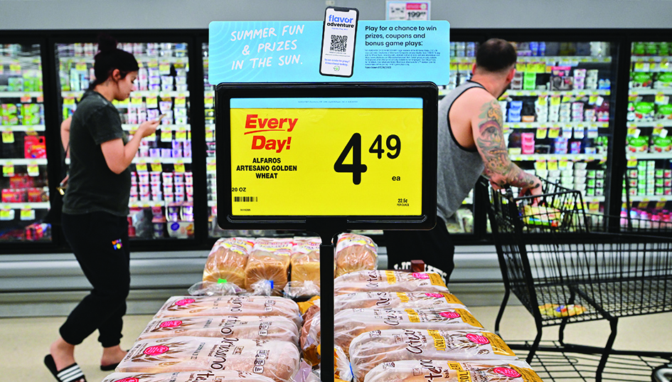ALHAMBRA, United States: People shop at a grocery supermarket in Alhambra, California, on July 13, 2022. US consumer price inflation surged 9.1 percent over the past 12 months to June, the fastest increase since November 1981, according to government data released on July 13. – AFP