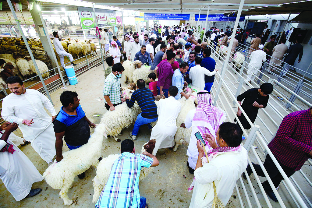 KUWAIT: People bring their sheep to be slaughtered on the Eid Al-Adha holiday at a slaughterhouse in Kuwait on July 9, 2022. -  Photo by Yasser Al-Zayyat