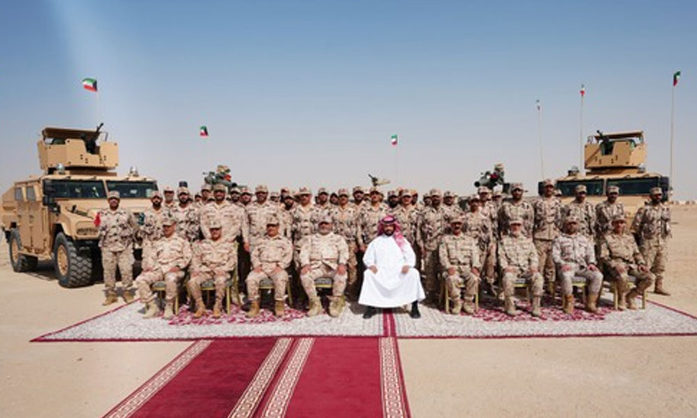 Defense Minister with Kuwaiti army personnel in the northern region