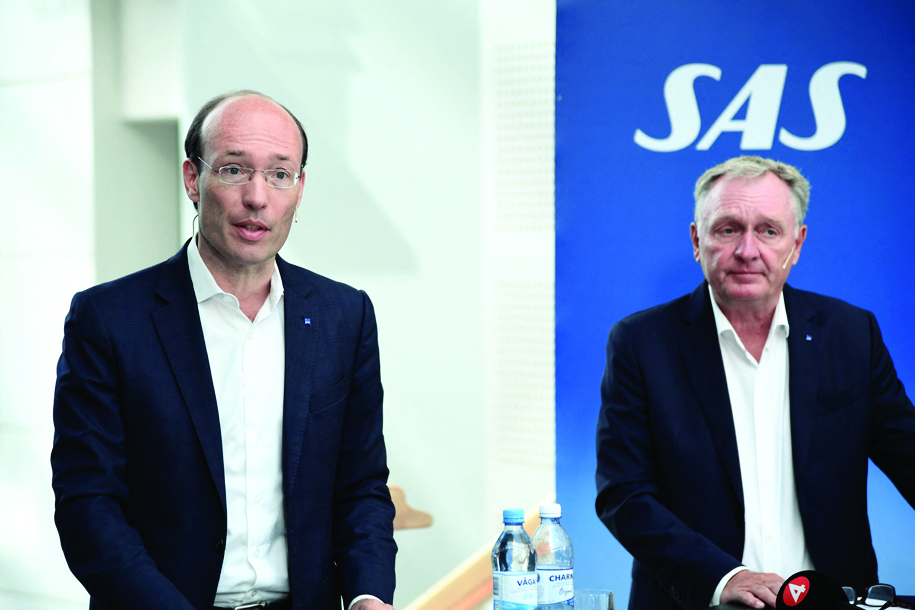 STOCKHOLM: President and CEO of SAS Anko van der Werff and Chairman of the Board of SAS Carsten Dilling address a press conference announcing that they will apply for bankruptcy protection in the US on July 5, 2022. - AFP