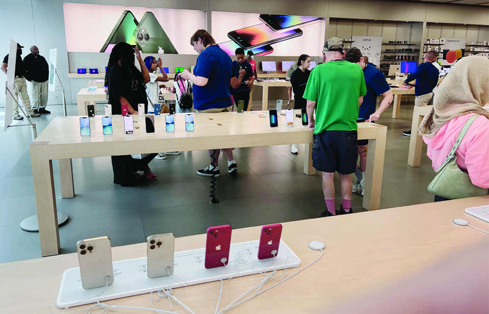 MARYLAND: Customers shop at The Apple Store at the Towson Town Center mall, the first of the company's retail locations in the US where workers voted to unionize.- AFP