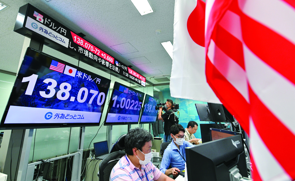 Tokyo: Electronic quotation boards display the yen's rate of 138 against the US dollar at a foreign exchange brokerage in Tokyo on July 14, 2022. – AFP