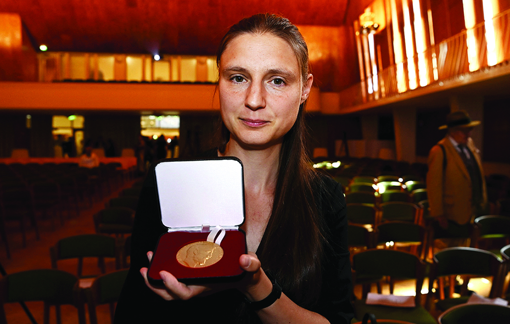 Ukraine's Maryna Viazovska presents her medal after receiving the 2022 Fields Prize for Mathematics during the International Congress of Mathematicians 2022 (ICM 2022) in Helsinki, Finland, on July 5, 2022. - AFP