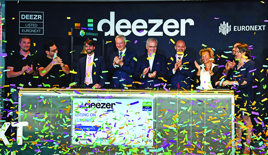 French Economy and Finance Minister Bruno Le Maire (center) attends the Deezer's listing ring the ball ceremony on the Pan-European stock exchange Euronext at Euronext headquarters in La Defense business district near Paris on July 5, 2022. - AFP
