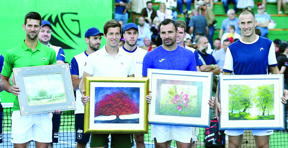 VISOKO: Serbian tennis player Novak Djokovic (left), Aljaz Bedene from Slovenia (2nd left), Ivan Dodig from Croatia (2nd right) and Bosnian player Aldin Setkic pose with theirs gifts after an exhibition match, organized to mark the opening of a tennis court at the 'Archaeological park of the Bosnian pyramid'.- AFP