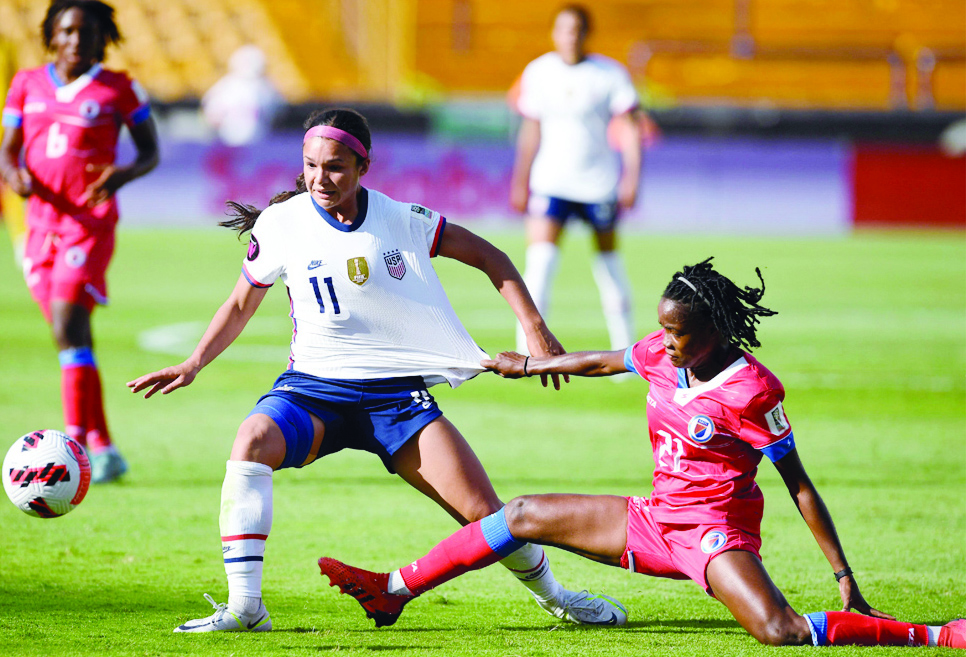 MONTERREY: US' Sophia Smith (center) vies for the ball with Haiti's Roselord Borgella during their 2022 Concacaf Women's Championship football match at the Universitario stadium in Monterrey, Nuevo Leon State, Mexico on July 4, 2022. - AFP