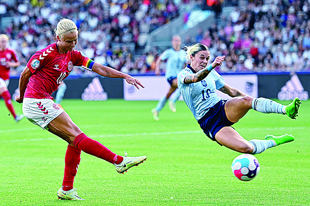 LONDON: Denmark's striker Pernille Harder (left) is challenged by Spain's defender Maria Leon during the UEFA Women's Euro 2022 Group B football match between Denmark and Spain at Brentford Community Stadium in west London on July 16, 2022. - AFP