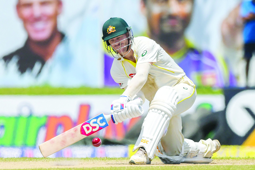 GALLE, Sri Lanka: Australia's David Warner plays a shot during the third day of first cricket Test match between Sri Lanka and Australia at the Galle International Cricket Stadium in Galle. – AFP
