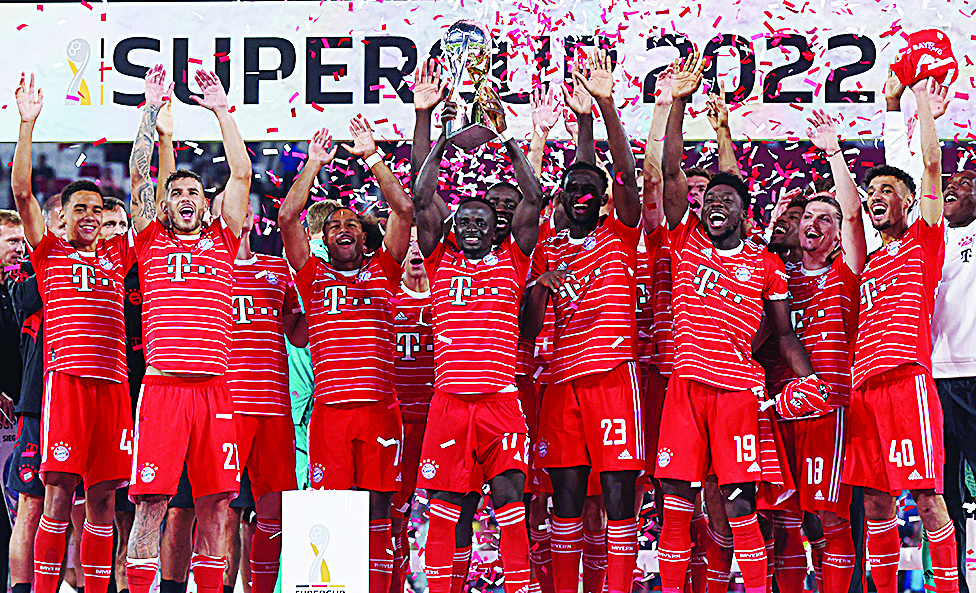 LEIPZIG: Bayern Munich's Senegalese forward Sadio Mane lifts the trophy after the German Supercup football match between RB Leipzig and FC Bayern Munich in Leipzig, on July 30, 2022. - AFP