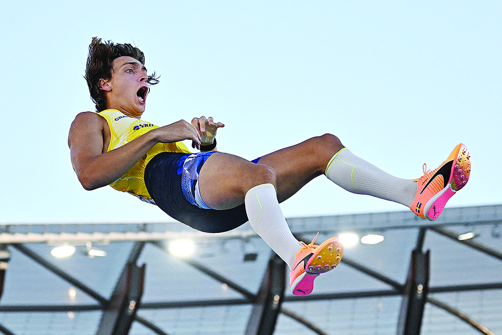 OREGON: Sweden's Armand Duplantis reacts as he sets a world record in the men's pole vault final during the World Athletics Championships at Hayward Field in Eugene, Oregon on July 24, 2022. - AFP